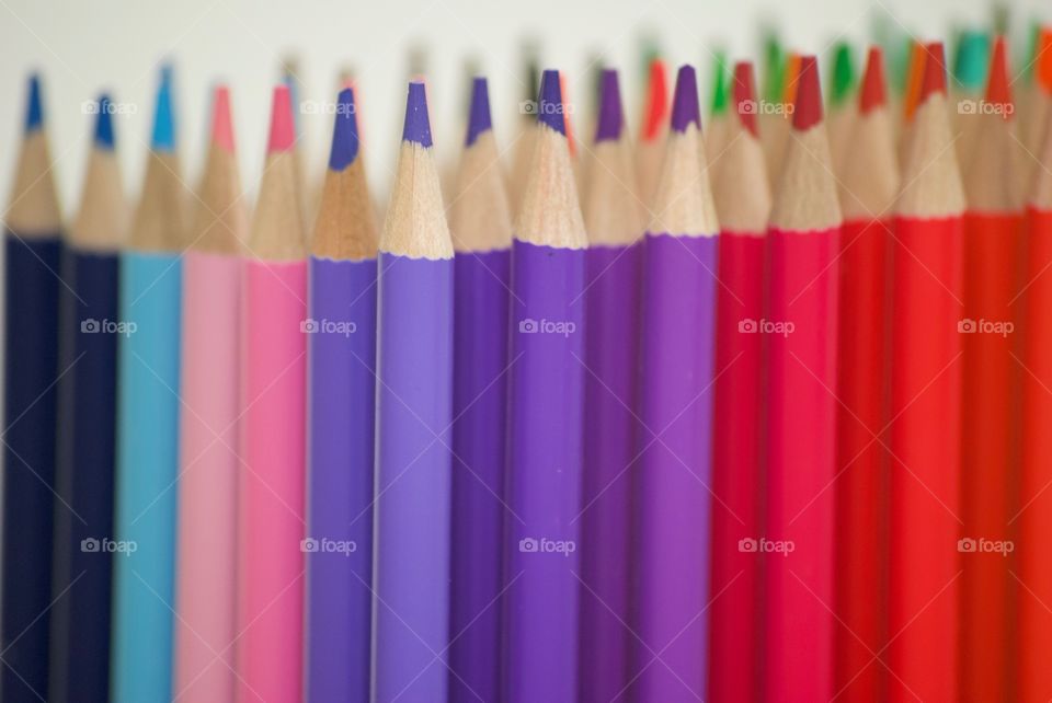 Colored pencils on a white background