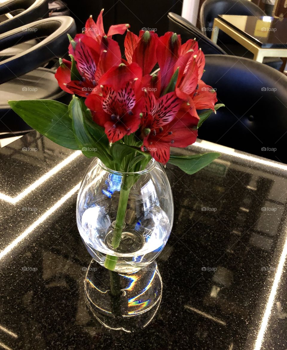 Red flowers bouquet on the table 