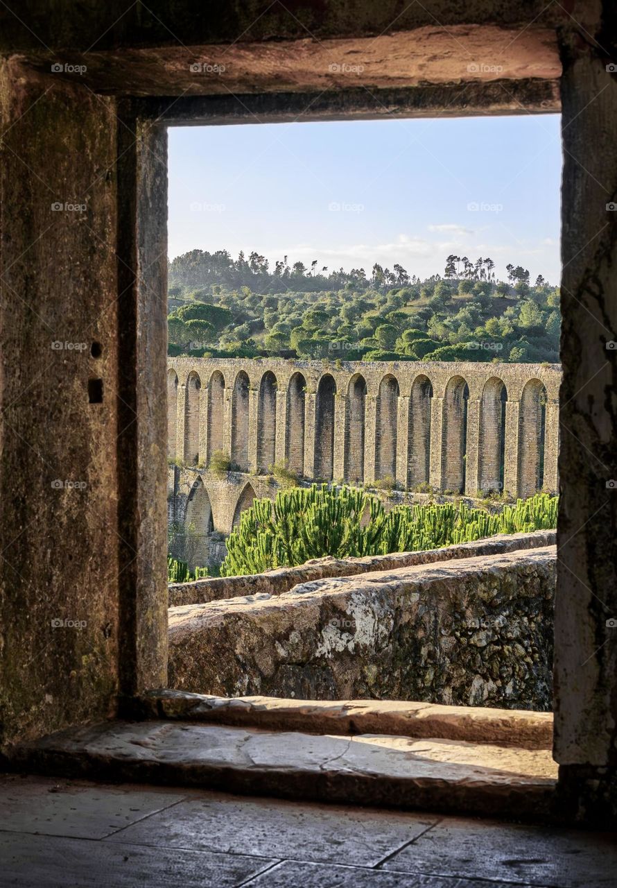 Acueducto de los Pegões viewed through the window hole of its tower