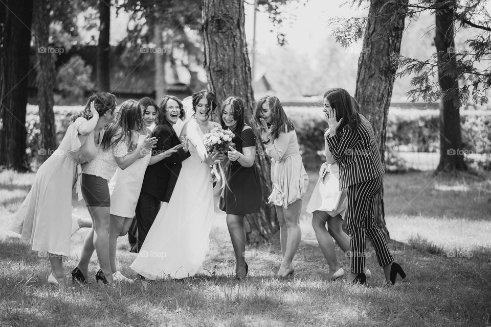 The bride's friends see the wedding ring for the first time