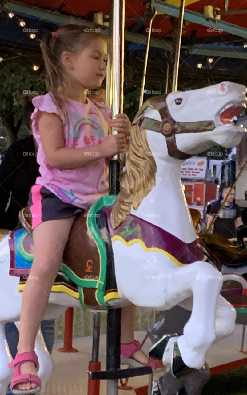 Riding A Horse On The Merry Go Round