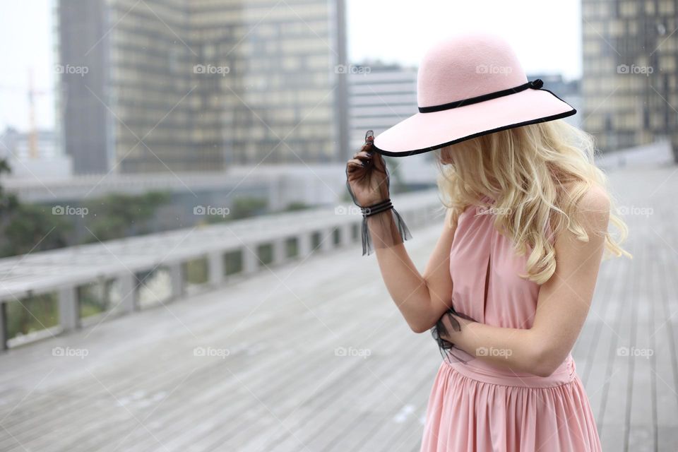Lady in pink dress and hat