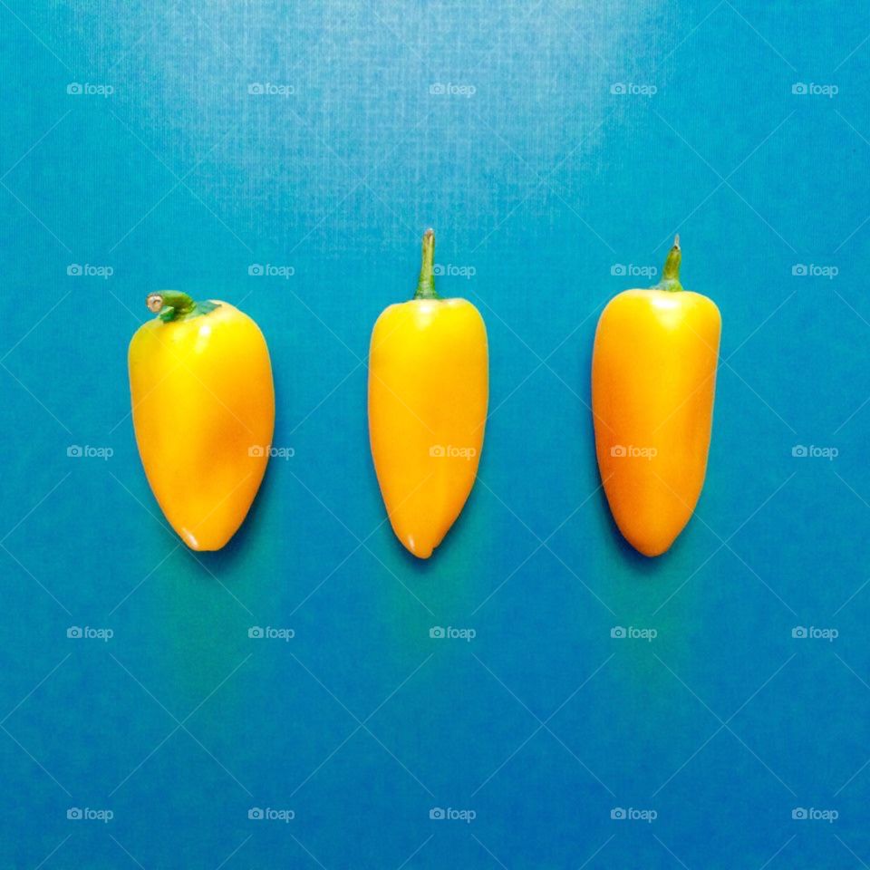Yellow Peppers on Blue