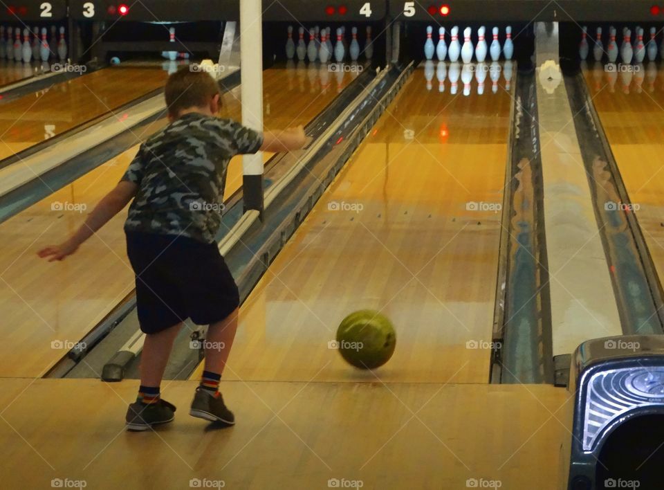 Young Boy Bowling