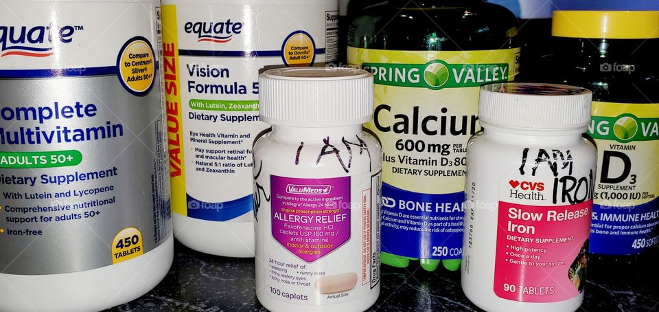 Bottles of vitamin supplements used by many people. Many vitamin bottles of supplements to take every day.