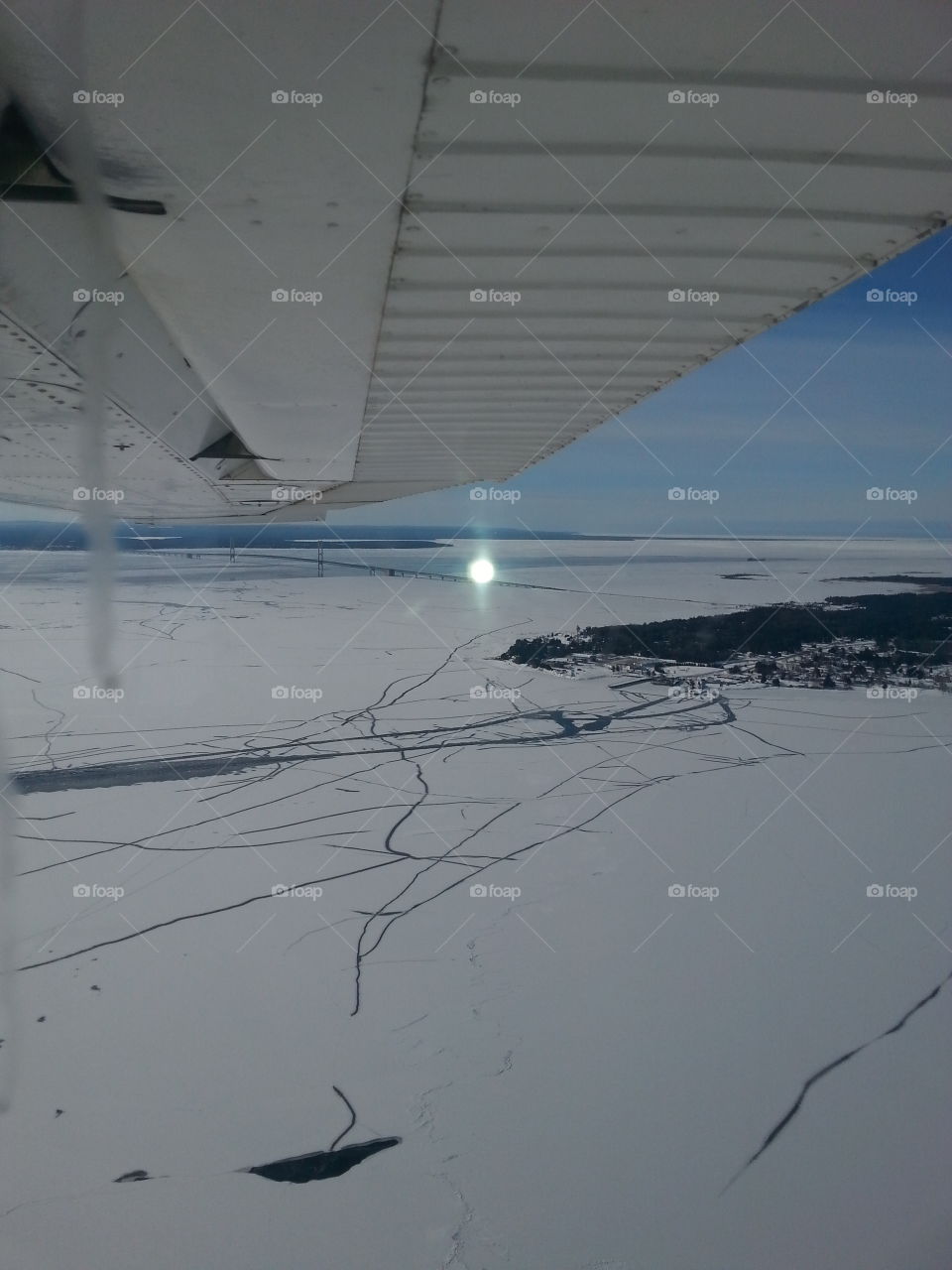 High Above The Ice . Flight over the Straits of Mackinaw 
