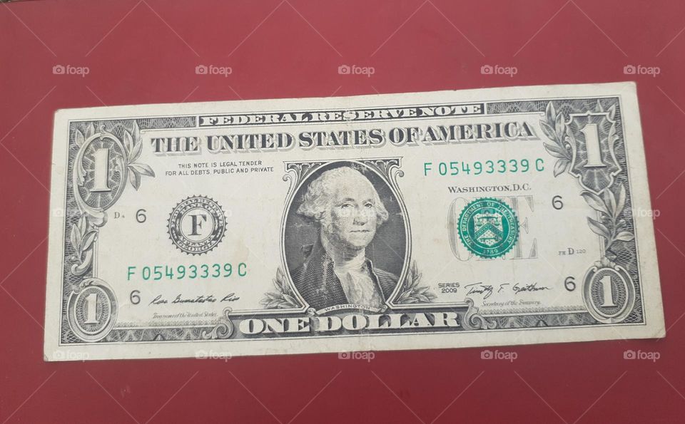 one dollar with red colour