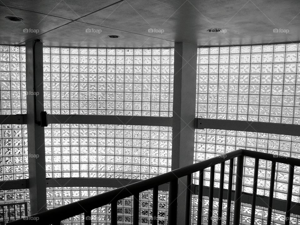 Circular glass block stairwell. Circular glass block window stairwell in black and white