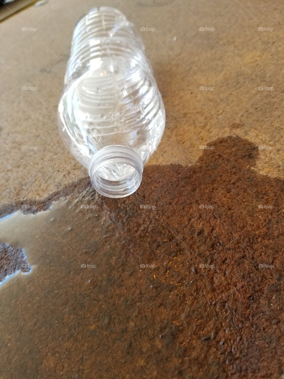 Bottle of water spilled over