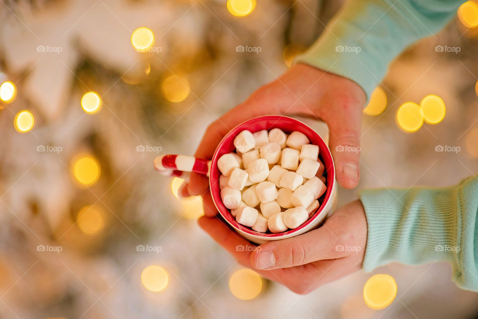 cup of coffee in a cozy festive Christmas atmosphere