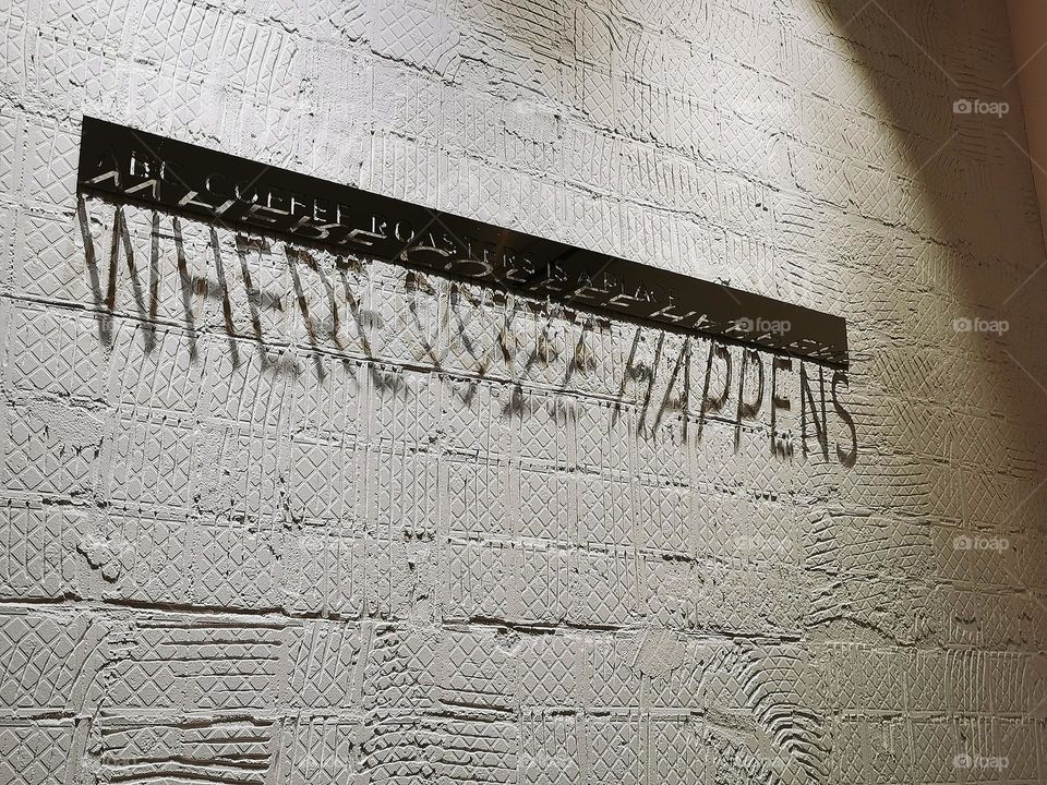 Shadow inscription on the wall in the cafe