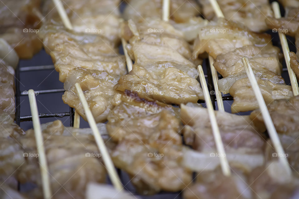 Grilled marinated pork with sauce Skewers and small on the steel grilles With the heat.