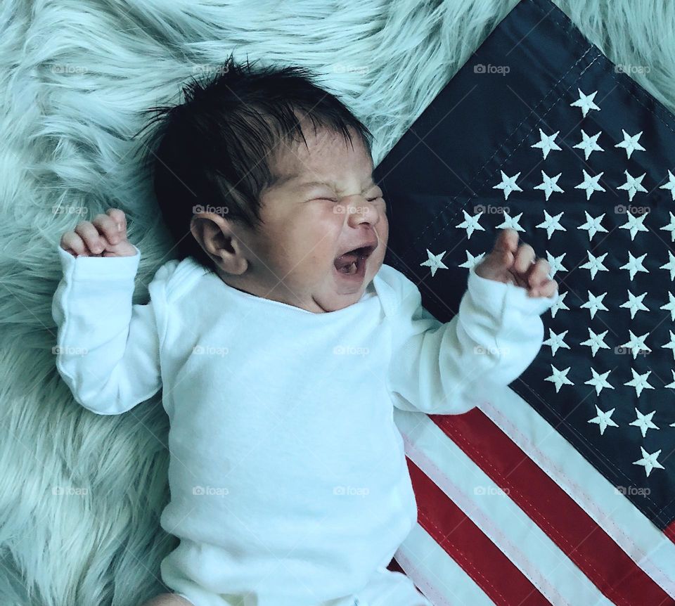 Baby crying with American flag, baby with USA flag, crying about the state of the country, baby wants justice for all, baby crying with the USA flag, comical American baby photo, kids do the funniest things, infant crying with United States flag