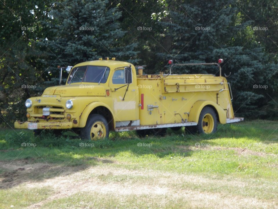 Abandoned yellow fire truck