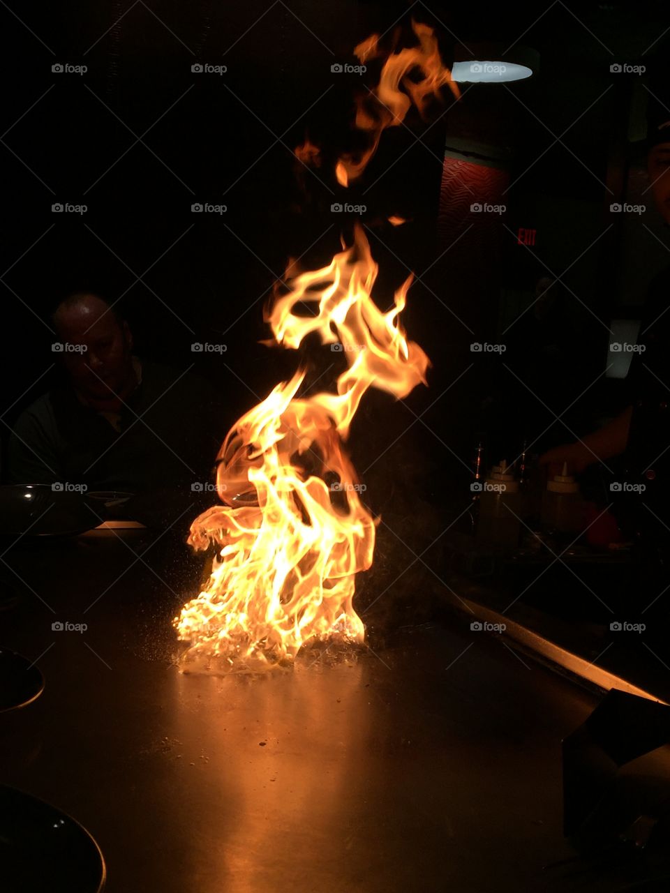 This is a picture of fire taken at a restaurant where the chef cooked our food right in front of us.