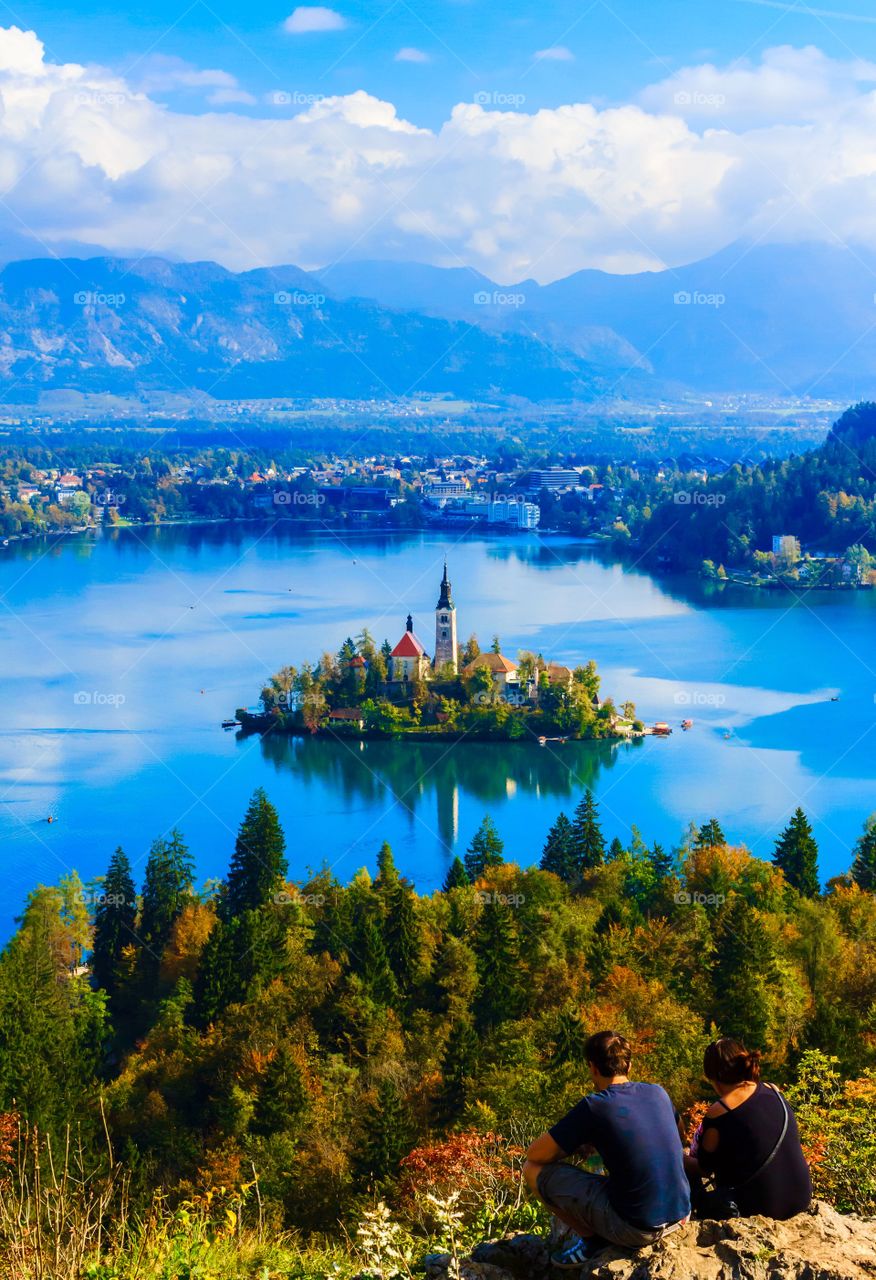 Couple enjoy autumn scene. Couple enjoy autumn scene of lake Bled, Slovenia, Europe 