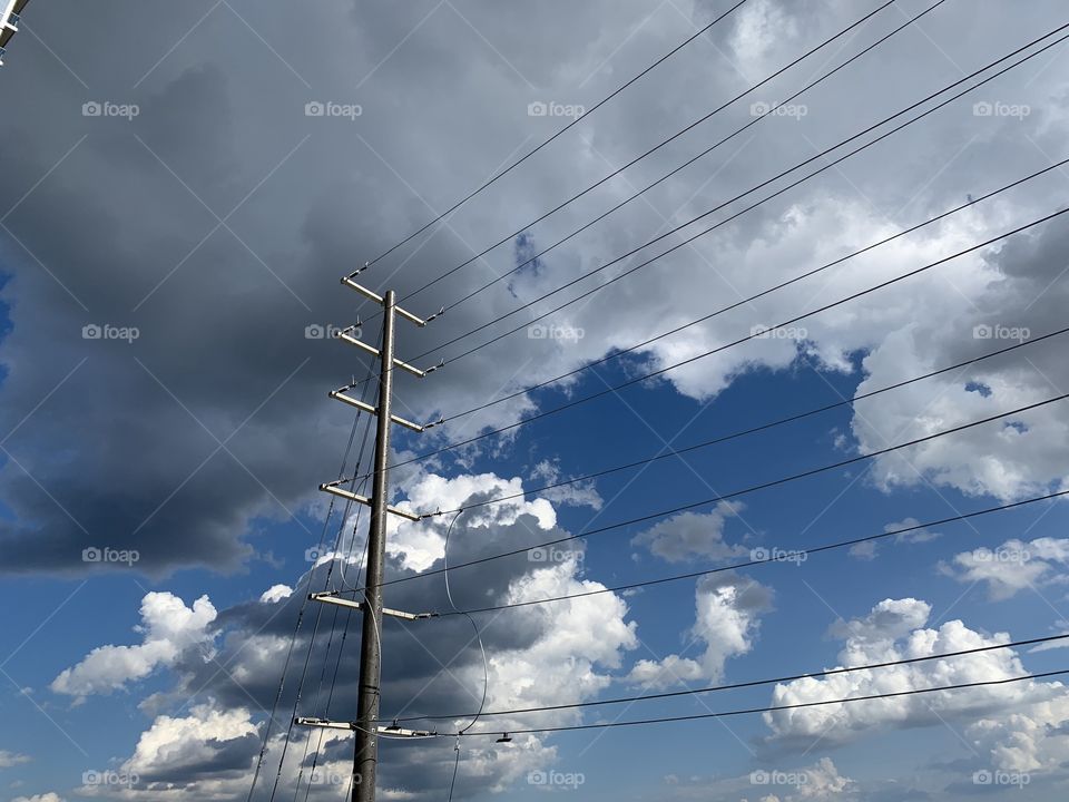 Clouds behind the wires..
