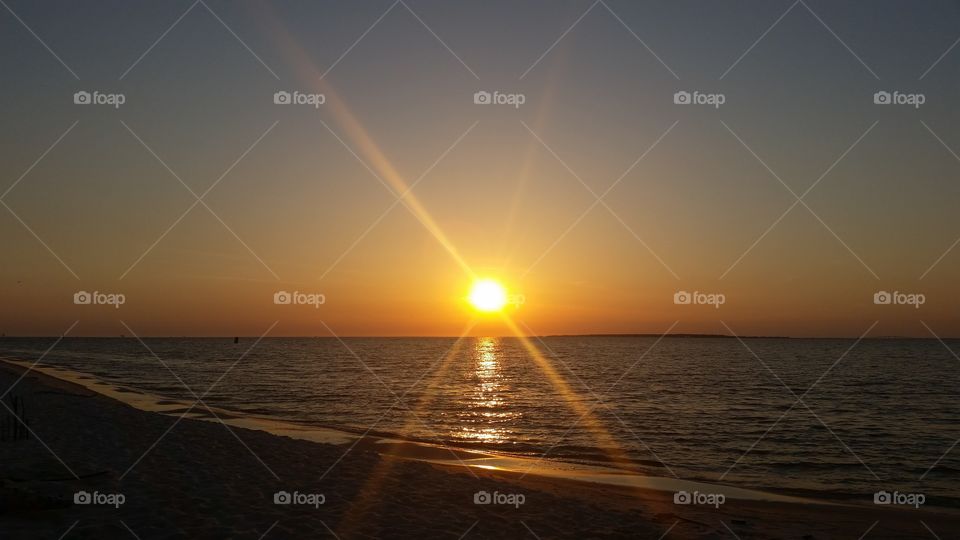 Scenic view of beach at dusk