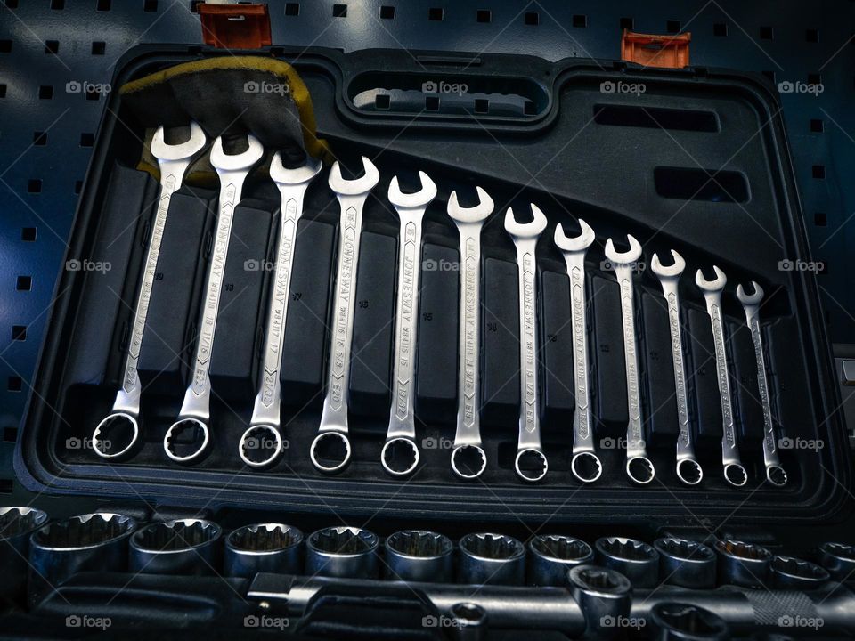 Close-up of spanners in a tool box