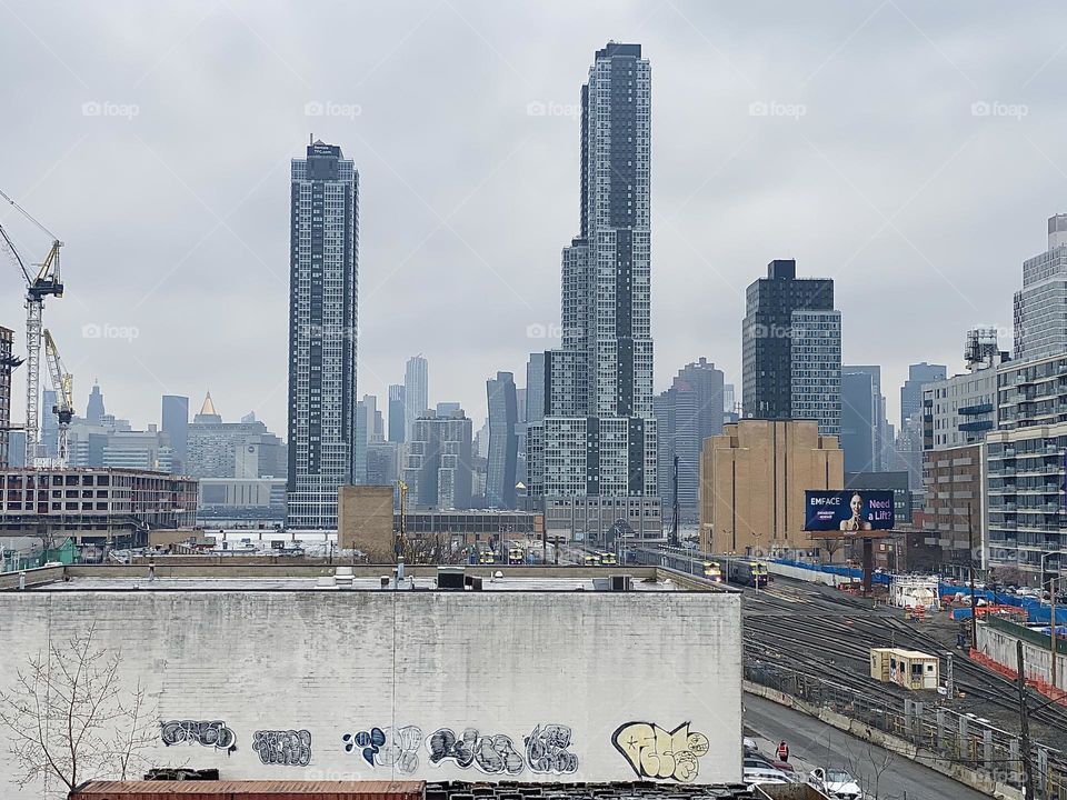Multiple rows of high rises and skyscrapers can be seen here looking from “Long Island City”, Queens all the way to Manhattan. 2023. Hypnotic Productions