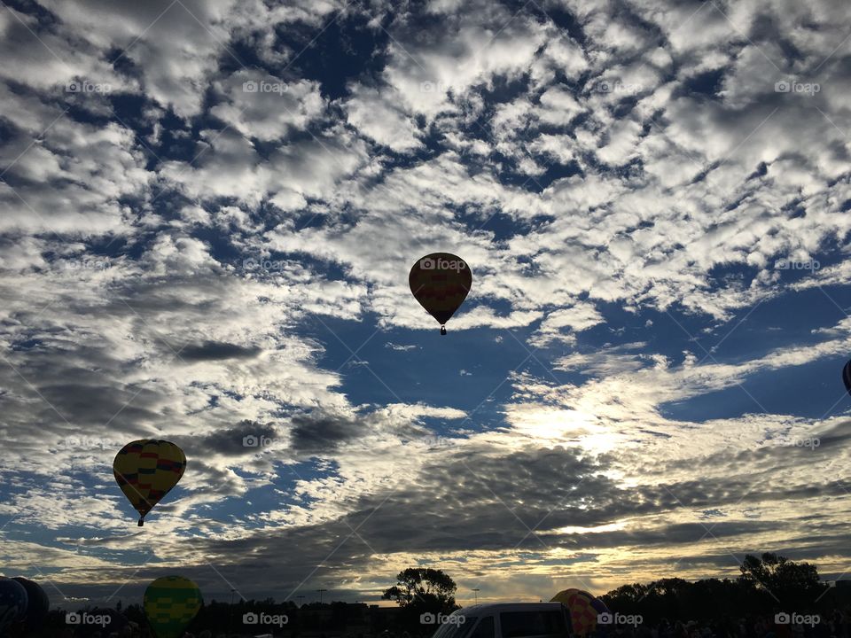 Balloons over sunrise
