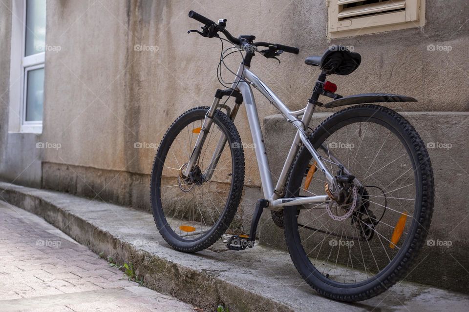 Sport bicycle stands near the wall