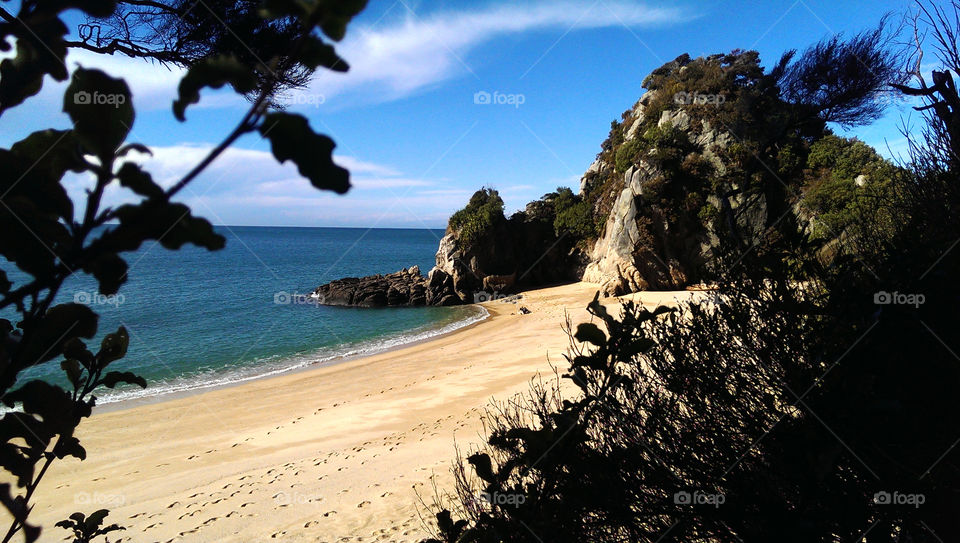 Scenic view of cliff at beach