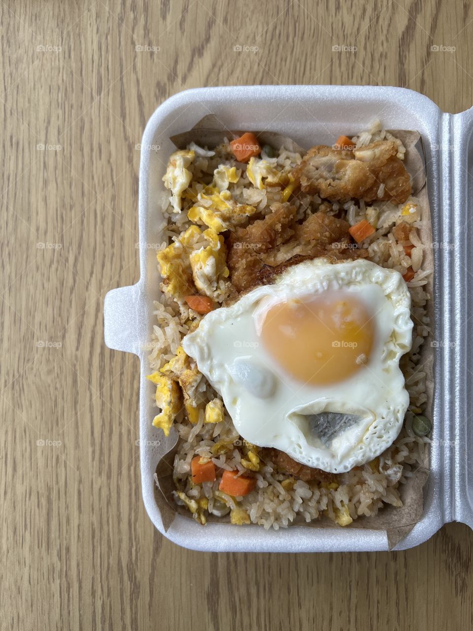 Local hawker asian dishes in cheesy floss carrot cake, crab meat char kway teow and fried rice with chicken and egg