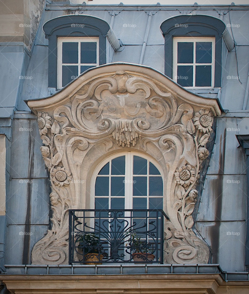 Window at the roof of an Parisian house. 