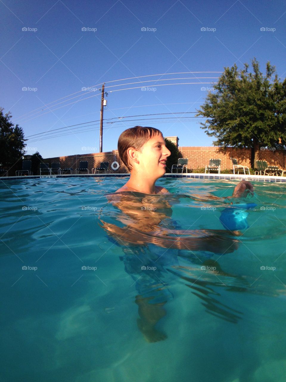 Ready, set, swim. View from in the pool of a boy playing 