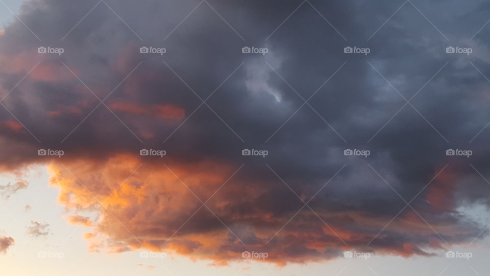 Sunset reflecting off dark clouds.