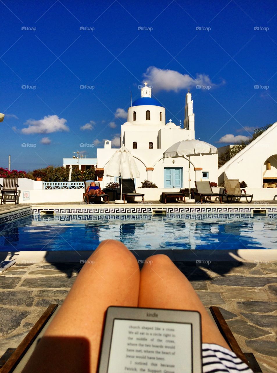 Relaxing by pool in Santorini 