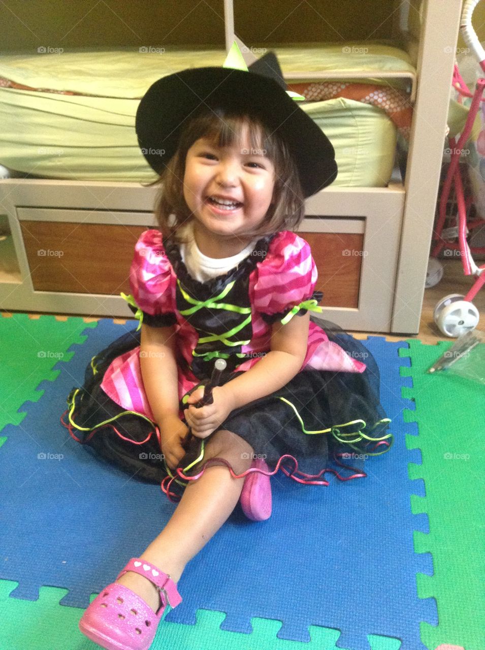 Happy preschool girl in a Halloween costume