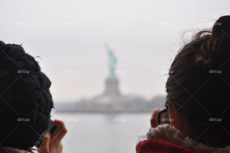 lookibg at the statue of liberty