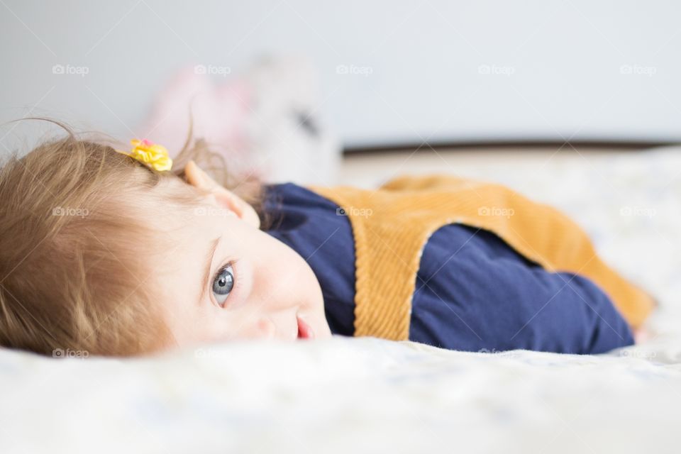 Girl lying on bed