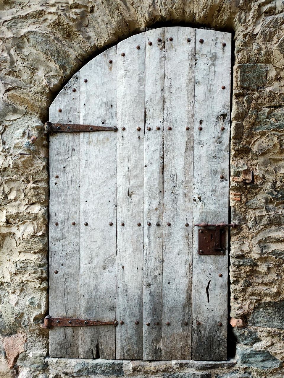 Old door and stone wall