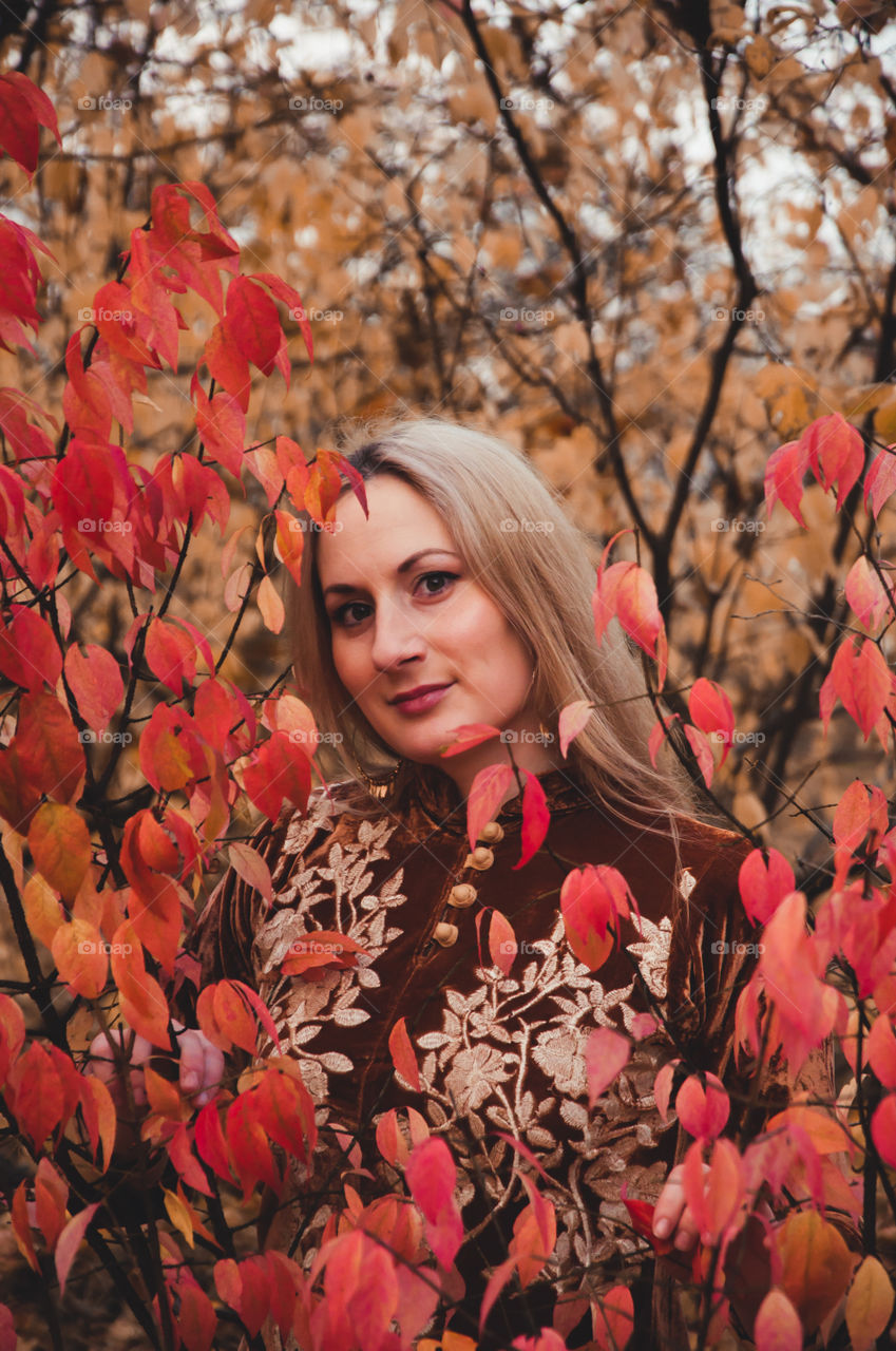 beautiful girl in the autumn forest