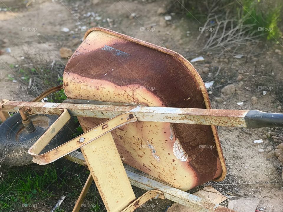 Rusty wheel barrel 