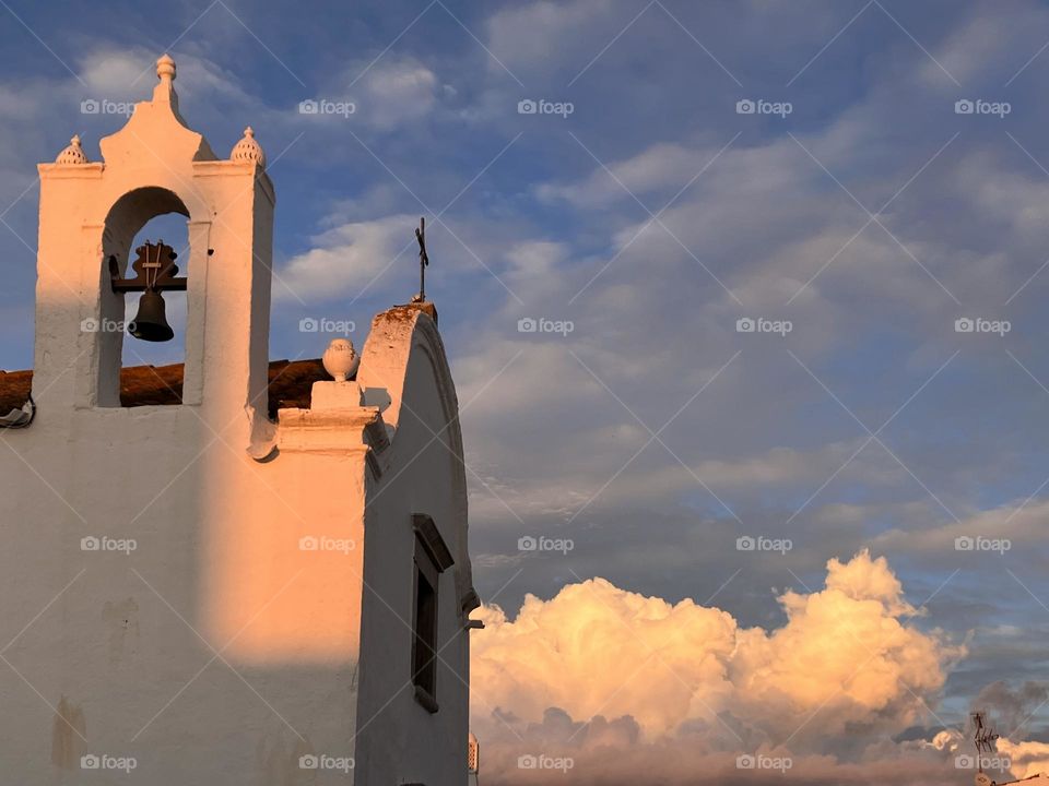 Portuguese church at sunset with clouds 