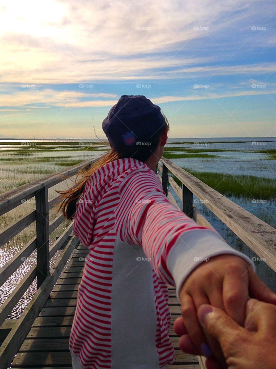 Follow me down the boardwalk. Walking out onto a boardwalk that extends out into the ocean with my sweet...follow me mission
