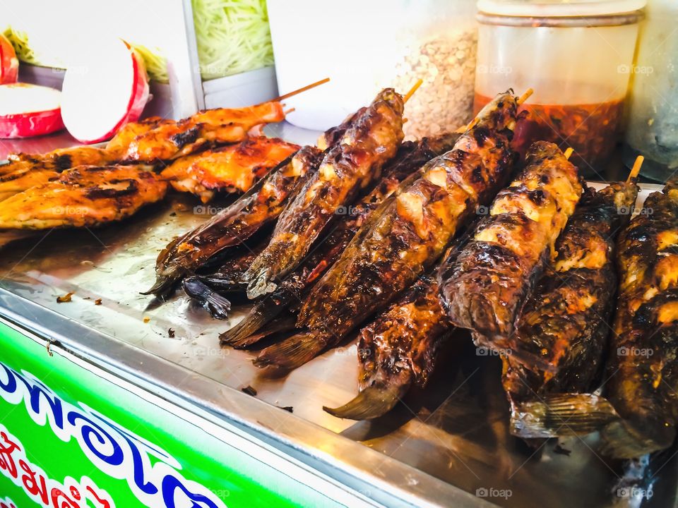 Delicious Catfish grilled and chicken grilled at street food in Thailand 