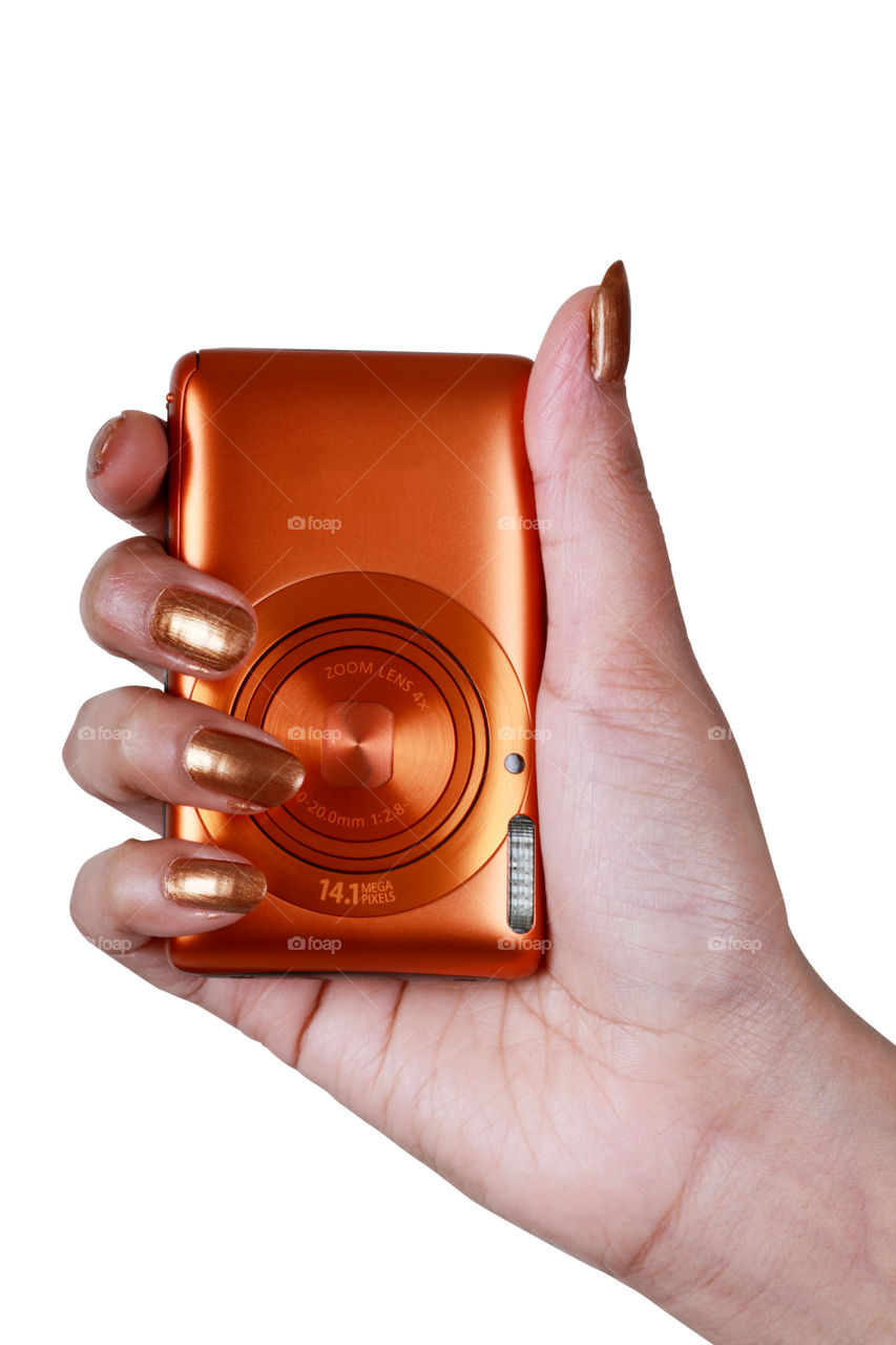 Modern digital camera on a female hand