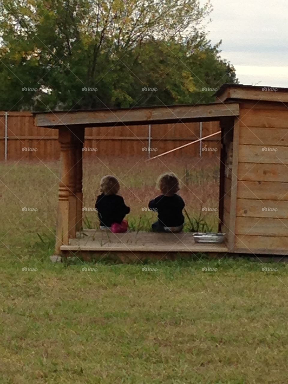 Twins spending time together . Siblings outdoors