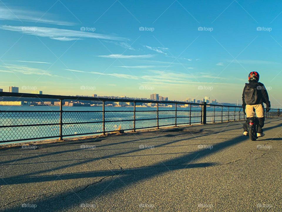 A man on his on wheel scooter 