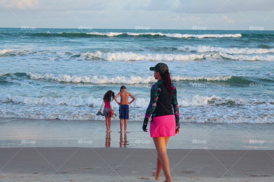 family walking on the beach