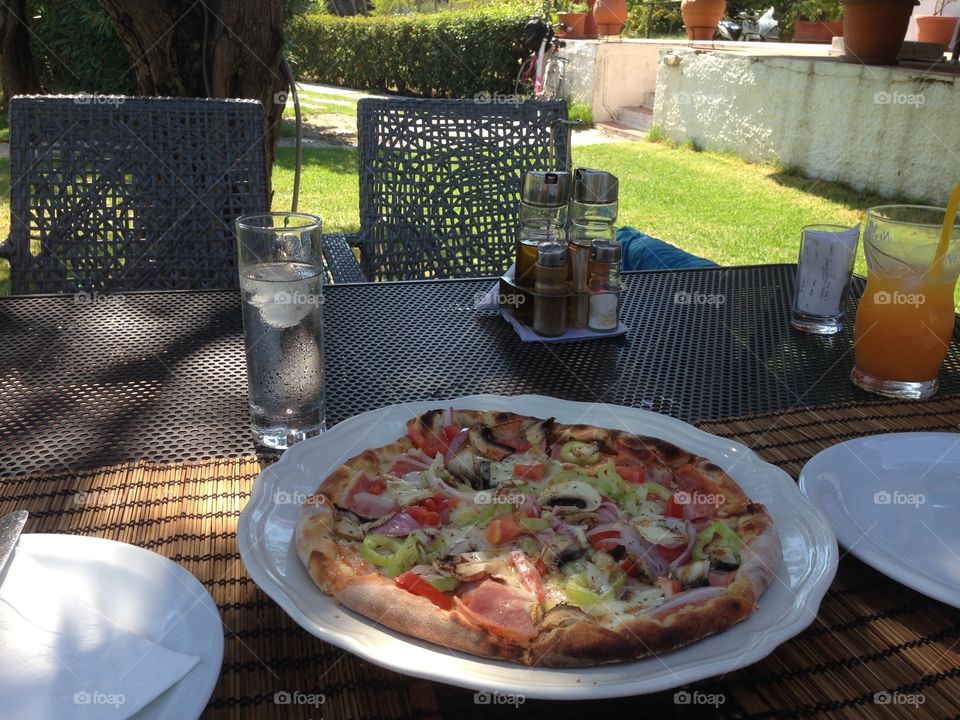 Enjoying a delicious pizza - alfresco!