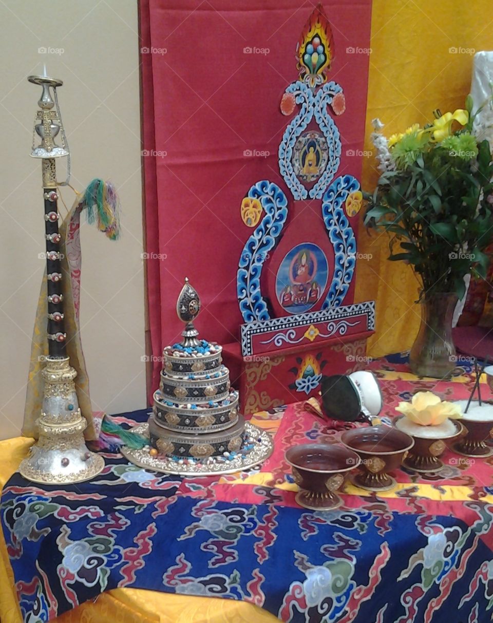 Tibetan Buddhist Altar with traditional Instruments and Offerings