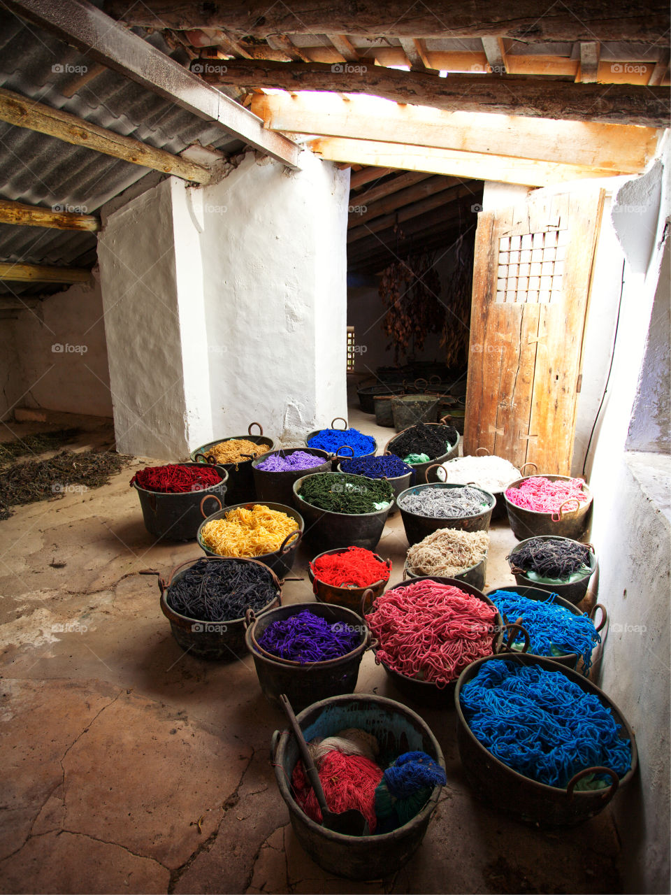 Colored yarn in buckets