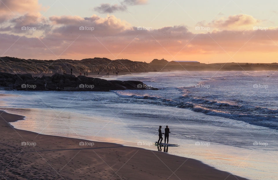 Surfers on the beach. 