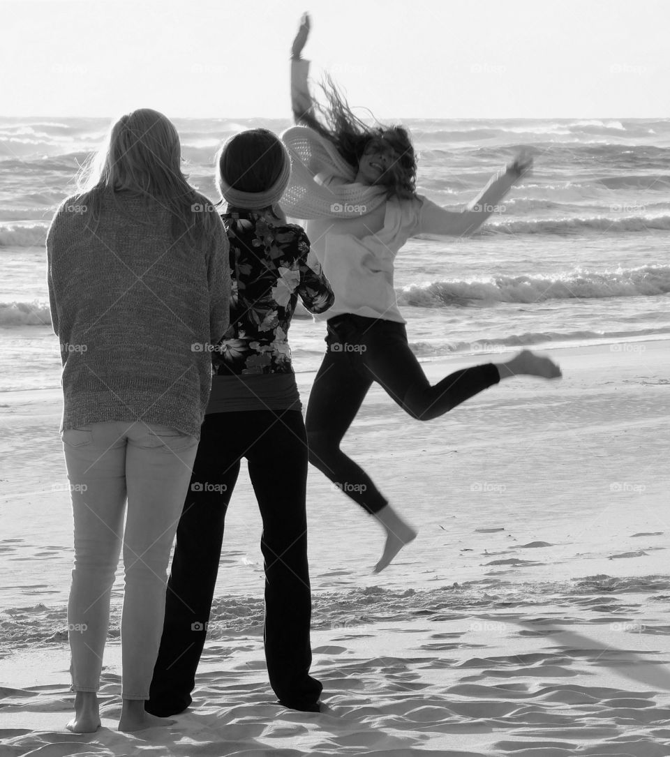 Jumping for joy on the sandy beach by the Gulf of Mexico!
A family from New England enjoying the warm breeze and sandy beach!